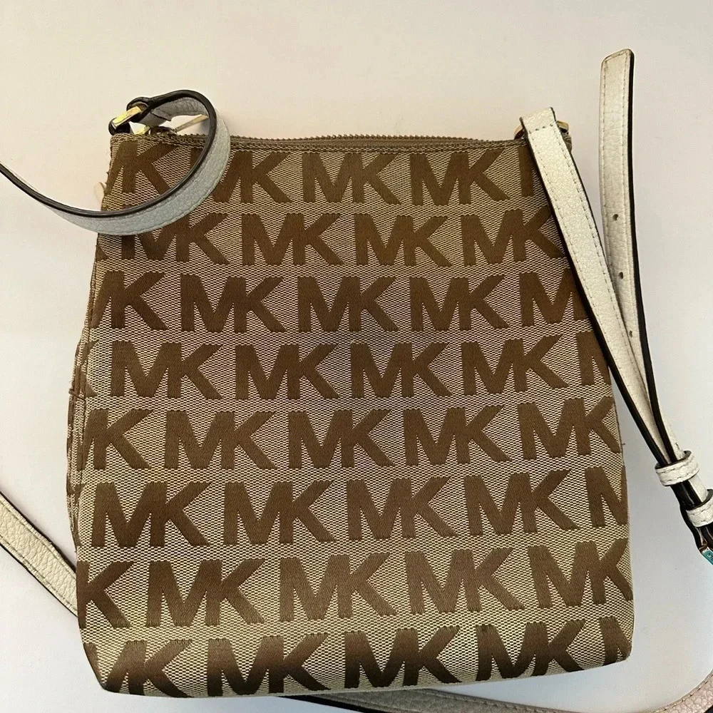 Michael Kors Monogram Drawstring Bucket Brown Mini WithTassel Crossbody Bag